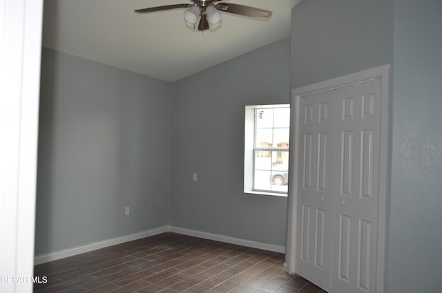 14309 Desierto Bueno Ave, Horizon City, TX 79928 - unfurnished bedroom featuring dark wood finished floors, vaulted ceiling, and ceiling fan