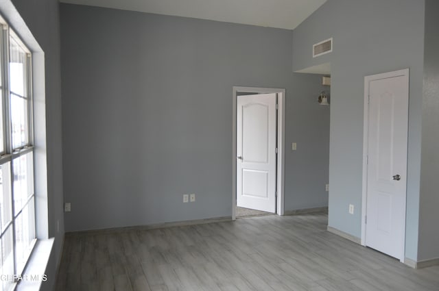 14309 Desierto Bueno Ave, Horizon City, TX 79928 - unfurnished room featuring light wood finished floors and a towering ceiling