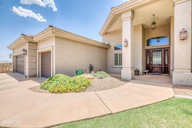 1348 Franklin Wind Place, El Paso, TX 79912 - entrance to property with stucco siding, a garage, and concrete driveway