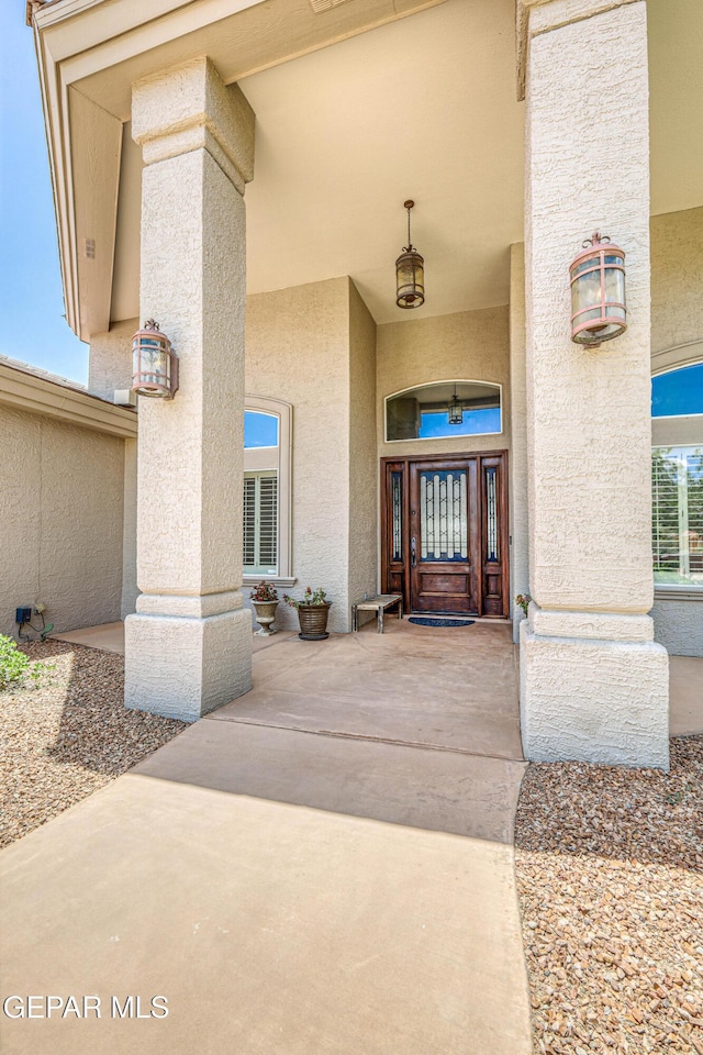 1348 Franklin Wind Place, El Paso, TX 79912 - property entrance with stucco siding and covered porch