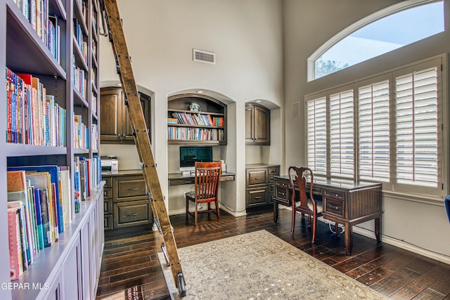 1348 Franklin Wind Place, El Paso, TX 79912 - home office with dark wood finished floors, built in desk, and a high ceiling