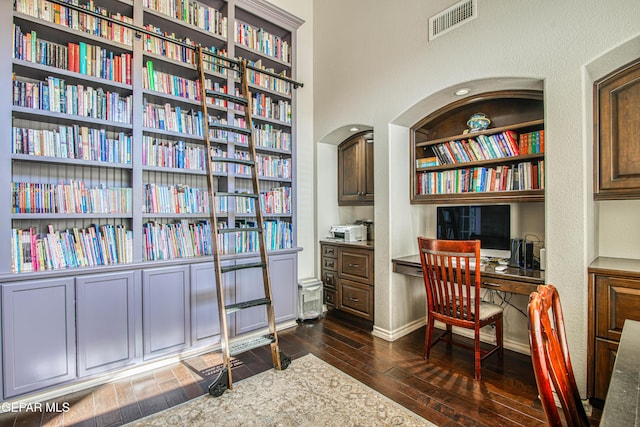 1348 Franklin Wind Place, El Paso, TX 79912 - home office featuring dark wood-type flooring and built in study area