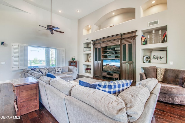 1348 Franklin Wind Place, El Paso, TX 79912 - living area featuring built in features, a high ceiling, dark wood finished floors, a ceiling fan, and recessed lighting