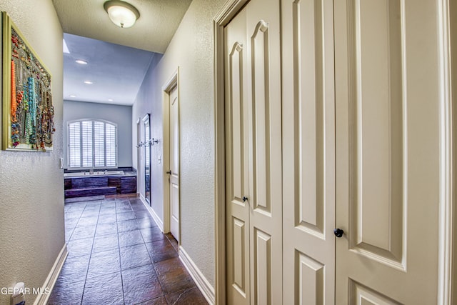 1348 Franklin Wind Place, El Paso, TX 79912 - hallway with a textured wall
