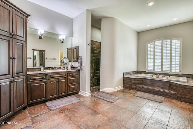 1348 Franklin Wind Place, El Paso, TX 79912 - full bath featuring a garden tub, vanity, tiled shower, recessed lighting, and stone tile flooring