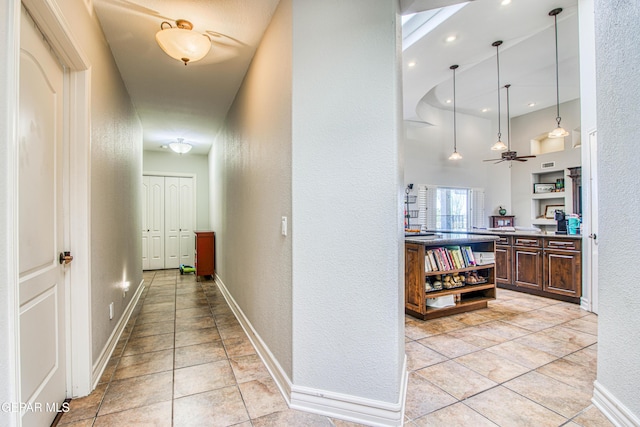 1348 Franklin Wind Place, El Paso, TX 79912 - corridor featuring a textured wall and light tile patterned flooring