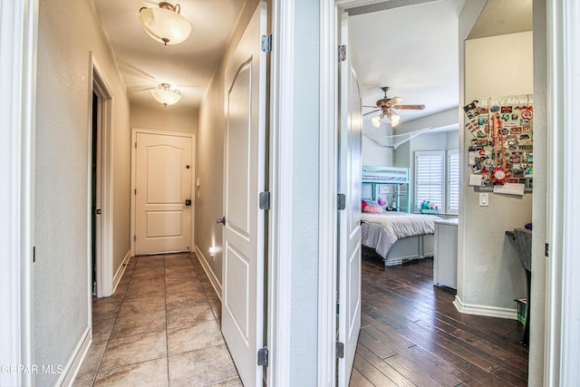 1348 Franklin Wind Place, El Paso, TX 79912 - hallway featuring a textured wall and hardwood / wood-style floors