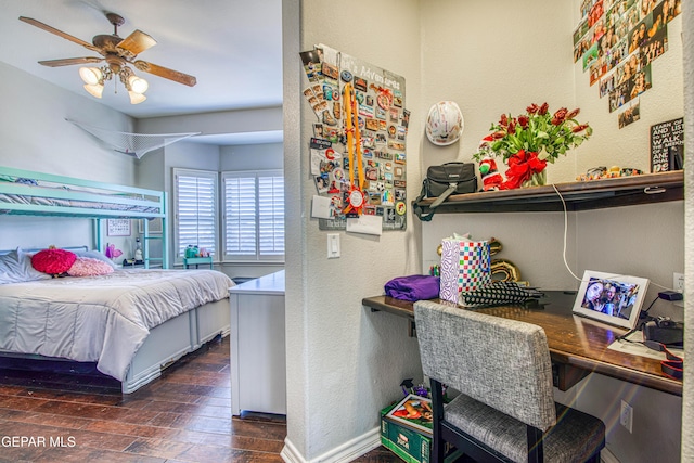 1348 Franklin Wind Place, El Paso, TX 79912 - bedroom with a textured wall, hardwood / wood-style flooring, an office area, and a ceiling fan