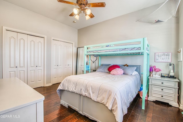 1348 Franklin Wind Place, El Paso, TX 79912 - bedroom with dark wood-style flooring, multiple closets, and a ceiling fan