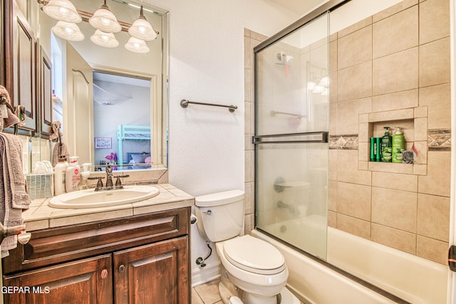1348 Franklin Wind Place, El Paso, TX 79912 - bathroom with vanity, bath / shower combo with glass door, and a textured wall