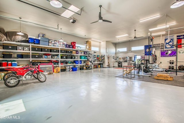 1348 Franklin Wind Place, El Paso, TX 79912 - garage with ceiling fan and a workshop area