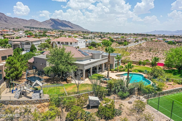 1348 Franklin Wind Place, El Paso, TX 79912 - aerial view of residential area with a mountainous background and a pool