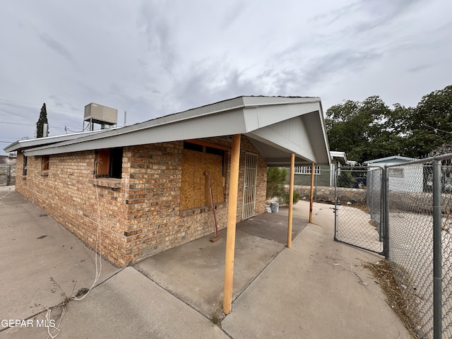 3726 Leavell Ave, El Paso, TX 79904 - view of property exterior with brick siding and a gate