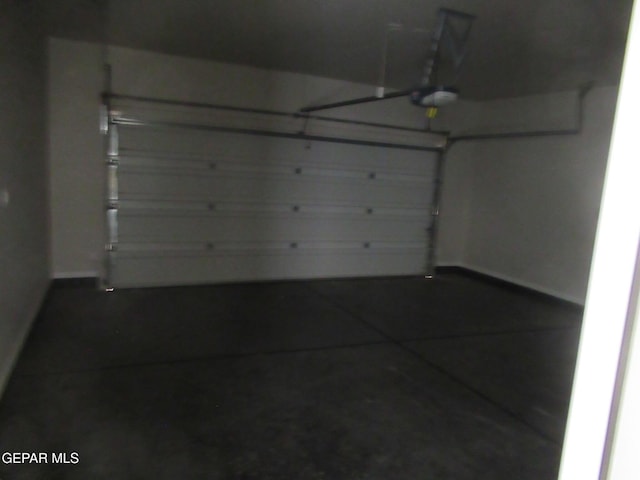205 Staffs Way, El Paso, TX 79928 - garage with baseboards and a garage door opener