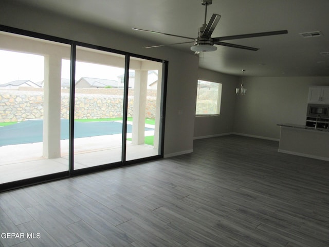 205 Staffs Way, El Paso, TX 79928 - unfurnished living room with ceiling fan and dark wood-style flooring