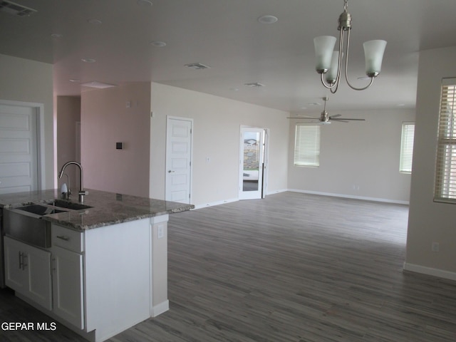 205 Staffs Way, El Paso, TX 79928 - kitchen featuring ceiling fan, open floor plan, dark wood finished floors, pendant lighting, and a kitchen island with sink