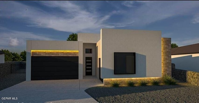7376 Cimarron Rim Dr, El Paso, TX 79911 - contemporary home featuring an attached garage, stucco siding, and concrete driveway