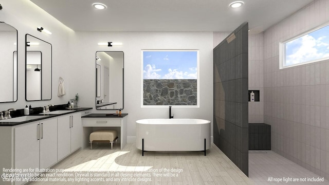 7376 Cimarron Rim Dr, El Paso, TX 79911 - full bathroom with a freestanding tub, double vanity, recessed lighting, and wood finished floors