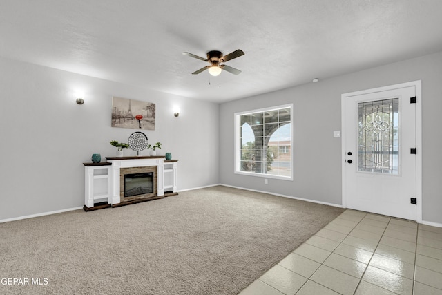 8936 Mount Rushmore Ln, El Paso, TX 79904 - unfurnished living room featuring a ceiling fan, plenty of natural light, carpet floors, and tile patterned floors