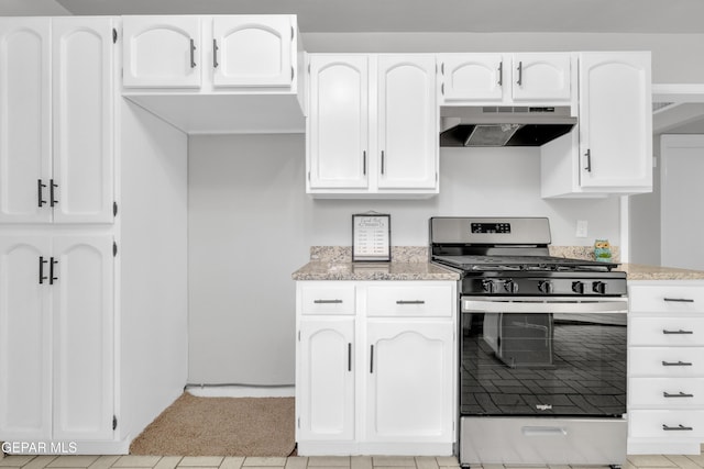 8936 Mount Rushmore Ln, El Paso, TX 79904 - kitchen with gas range, under cabinet range hood, white cabinetry, and light stone counters