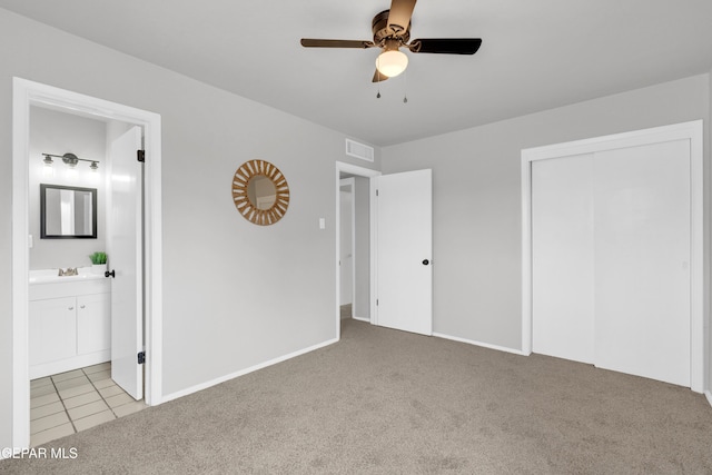 8936 Mount Rushmore Ln, El Paso, TX 79904 - unfurnished bedroom with carpet flooring, connected bathroom, a closet, and ceiling fan