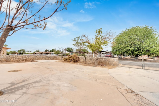 8936 Mount Rushmore Ln, El Paso, TX 79904 - fenced front yard with a gate and driveway