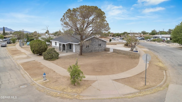 8936 Mount Rushmore Ln, El Paso, TX 79904 - view of front of property with a mountain view and a residential view