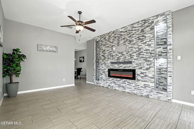 13675 Everingham St, El Paso, TX 79928 - unfurnished living room with a ceiling fan, wood tiled floors, and a fireplace