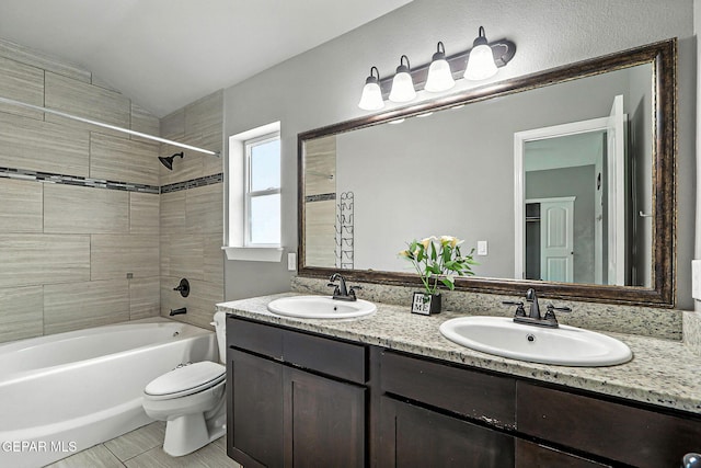 13675 Everingham St, El Paso, TX 79928 - bathroom with double vanity, shower / tub combination, and lofted ceiling