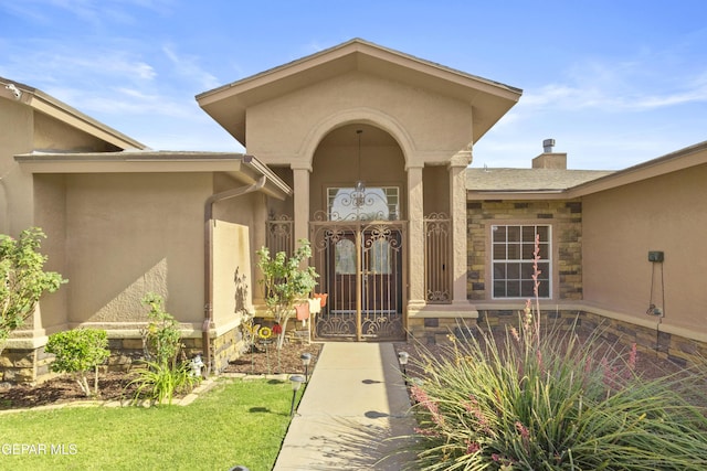 658 Sara Lynn Ct, El Paso, TX 79932 - entrance to property with stone siding, stucco siding, and a chimney