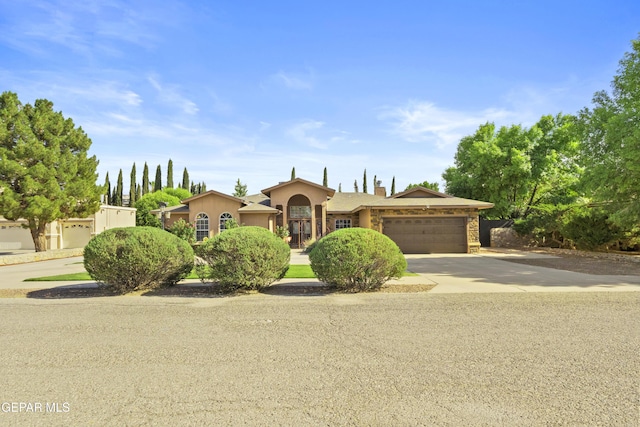 658 Sara Lynn Ct, El Paso, TX 79932 - view of front facade with a garage, concrete driveway, and stucco siding