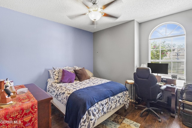 658 Sara Lynn Ct, El Paso, TX 79932 - bedroom featuring wood finished floors, a textured ceiling, a desk, and a ceiling fan