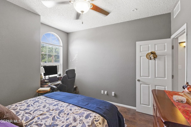 658 Sara Lynn Ct, El Paso, TX 79932 - bedroom with wood finished floors, a textured ceiling, a textured wall, a ceiling fan, and an office area