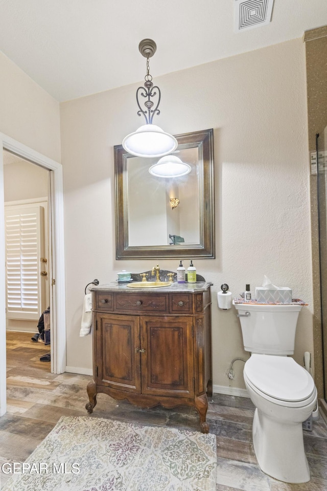 658 Sara Lynn Ct, El Paso, TX 79932 - bathroom featuring wood finished floors and vanity