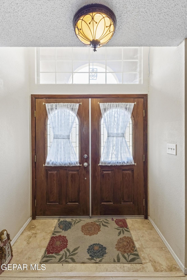 658 Sara Lynn Ct, El Paso, TX 79932 - foyer featuring baseboards and a textured ceiling