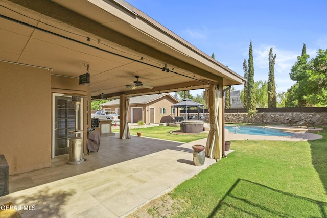 658 Sara Lynn Ct, El Paso, TX 79932 - fenced backyard with a gazebo, a patio area, a hot tub, and ceiling fan