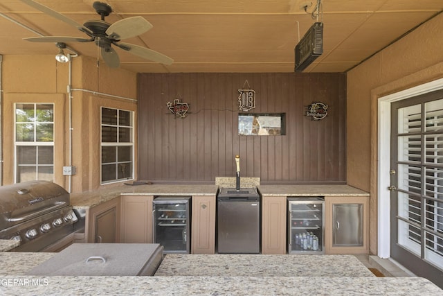 658 Sara Lynn Ct, El Paso, TX 79932 - view of patio featuring wine cooler, exterior kitchen, and a ceiling fan