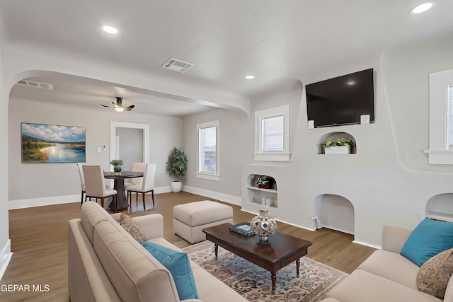 3413 Monroe Ave, El Paso, TX 79930 - living room featuring arched walkways, wood finished floors, recessed lighting, and ceiling fan