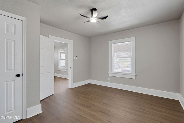 3413 Monroe Ave, El Paso, TX 79930 - spare room with dark wood finished floors, ceiling fan, and a textured ceiling