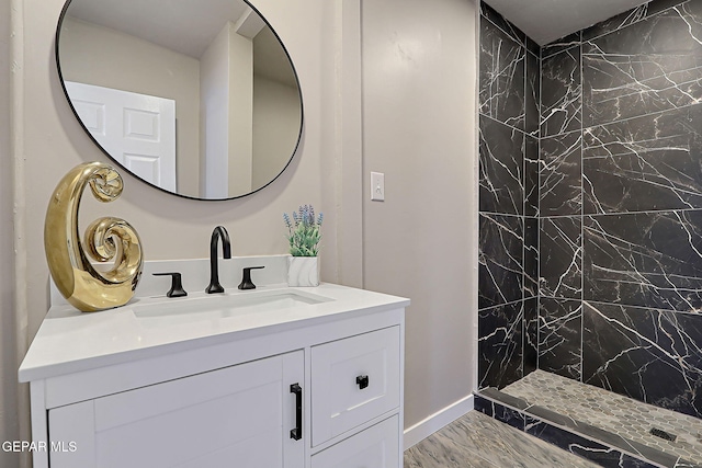 3413 Monroe Ave, El Paso, TX 79930 - bathroom featuring marble look tiles, a marble finish shower, and vanity