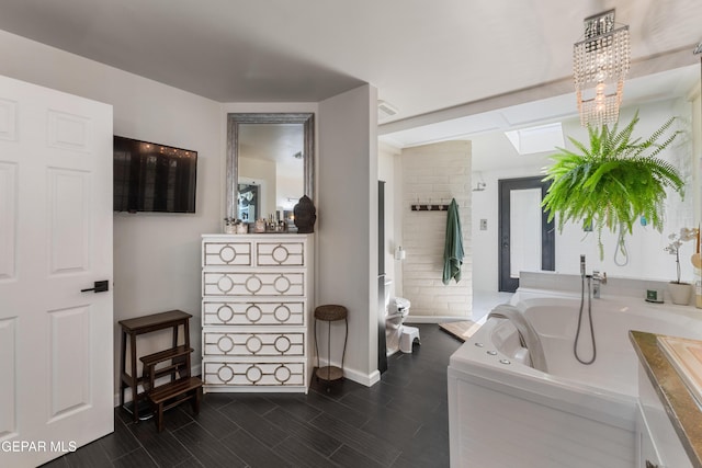1386 Loma Verde Dr, El Paso, TX 79936 - interior space featuring baseboards and a skylight
