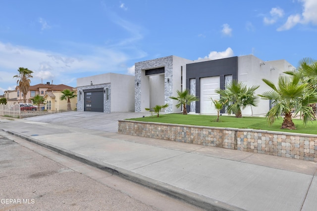 11345 Patricia Ave, El Paso, TX 79936 - contemporary home with stucco siding, driveway, and stone siding