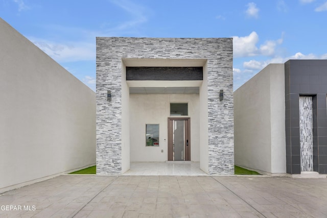 11345 Patricia Ave, El Paso, TX 79936 - property entrance featuring stone siding and stucco siding