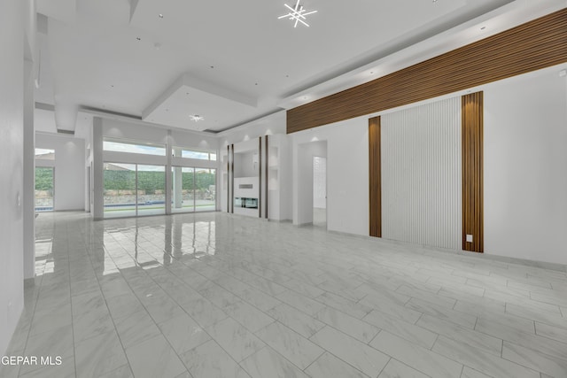11345 Patricia Ave, El Paso, TX 79936 - unfurnished room with marble look tiles and a raised ceiling