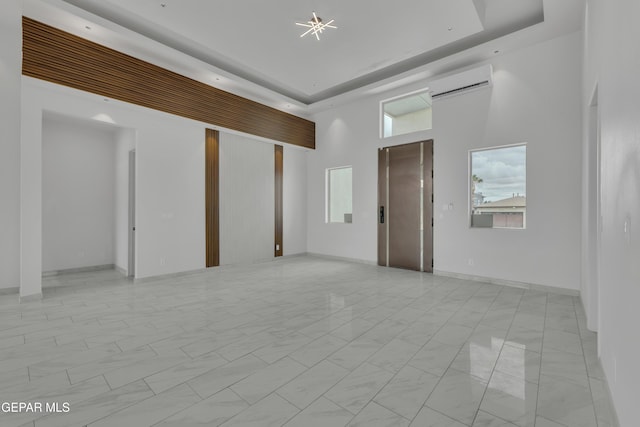 11345 Patricia Ave, El Paso, TX 79936 - basement with a wall unit AC and light marble finish floors