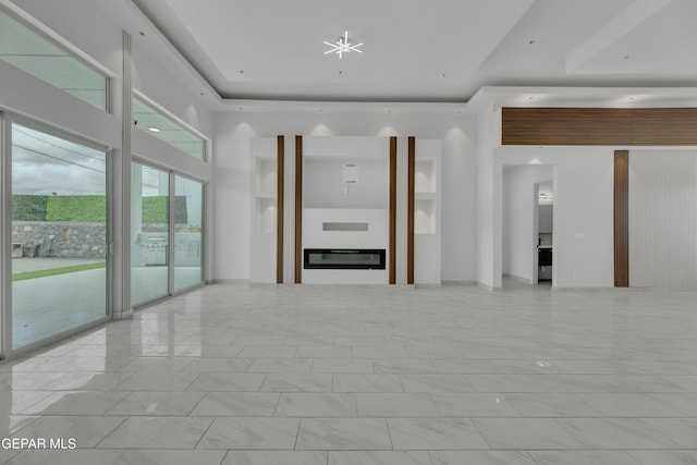 11345 Patricia Ave, El Paso, TX 79936 - unfurnished living room featuring a raised ceiling and marble look tiles