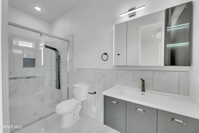 11345 Patricia Ave, El Paso, TX 79936 - bathroom with vanity, a shower stall, tile walls, and marble finish floors