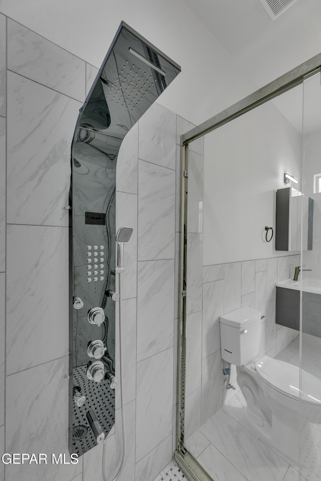 11345 Patricia Ave, El Paso, TX 79936 - full bath with tile walls, a stall shower, and vanity