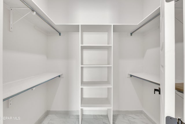 11345 Patricia Ave, El Paso, TX 79936 - spacious closet featuring light marble finish flooring