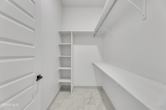 11345 Patricia Ave, El Paso, TX 79936 - walk in closet with light marble finish flooring